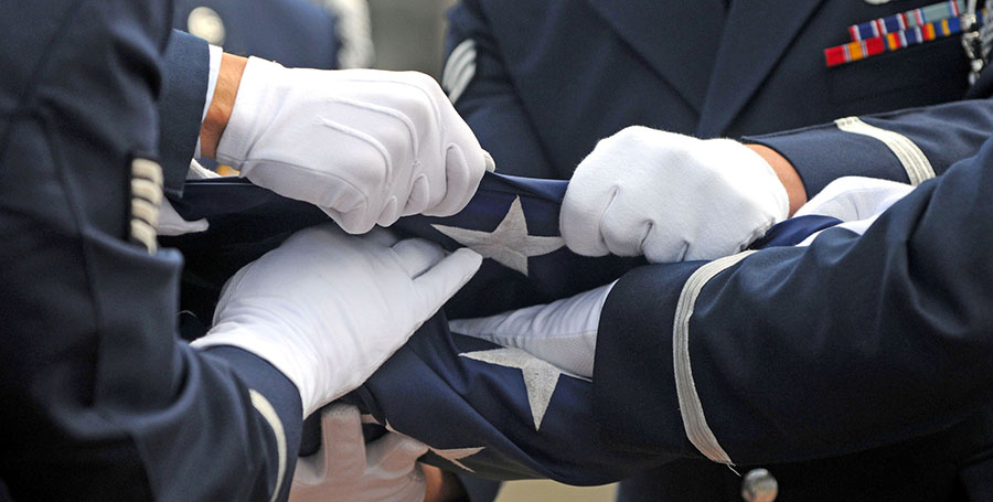 Members of the 86th Airlift Wing base honor guard conduct a flag-folding ceremony during the Ramstein Honor Guard Appreciation Day, Sept. 11, 2009, at Ramstein Air Base, Germany. (U.S. Air Force photo/Staff Sgt. Charity Barrett)